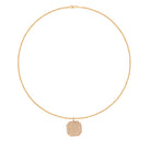 Gold necklace with a diamond pave pendant on a white background