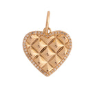 Gold heart-shaped pendant on a white background