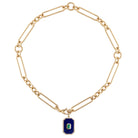 A 14k gold chunky mixed link chain with a lapis and emerald pendant on a white background. 