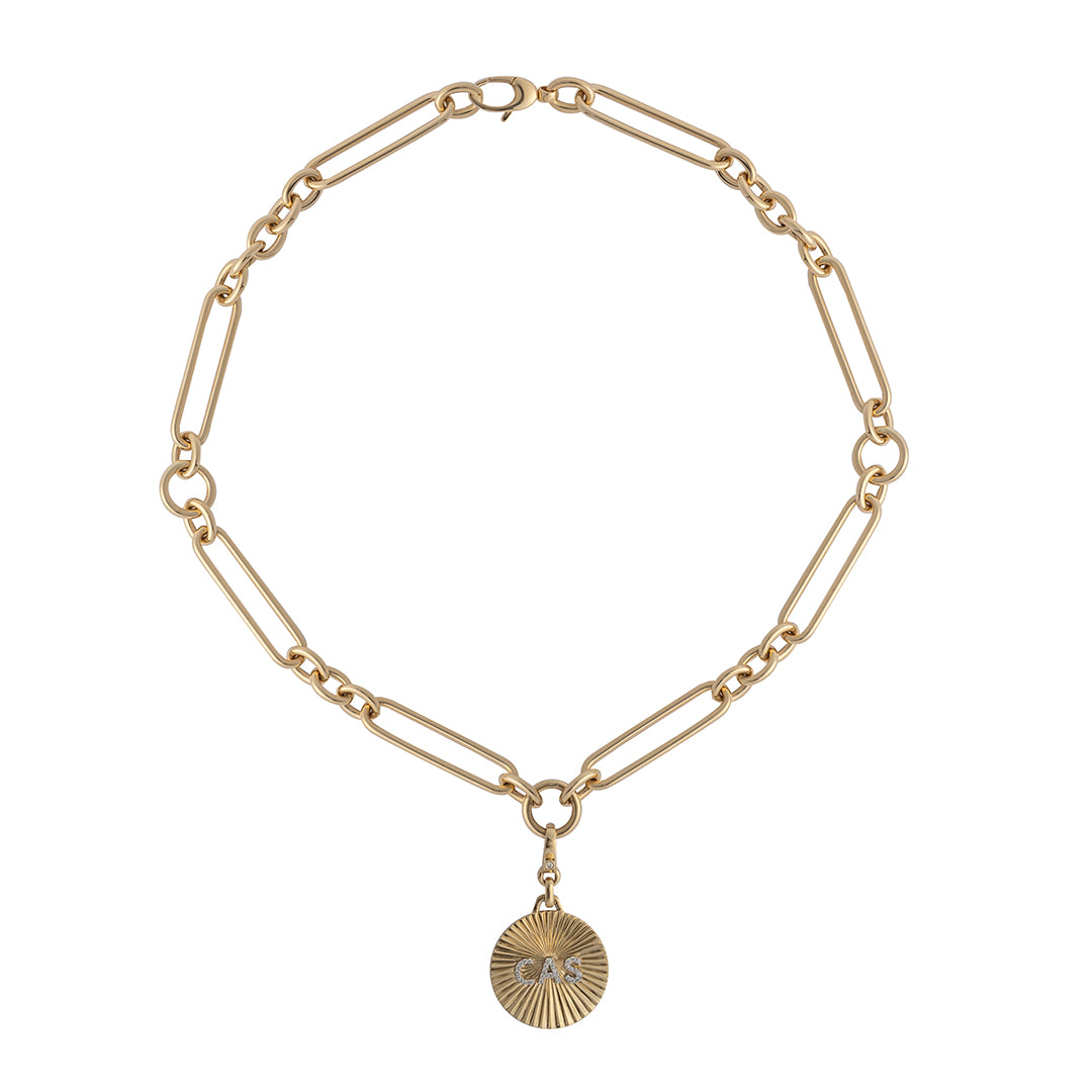 A 14k gold chunky mixed link chain with a custom gold pendant on a white backgroud. 