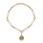 A 14k gold chunky mixed link chain with a custom gold pendant on a white backgroud. 