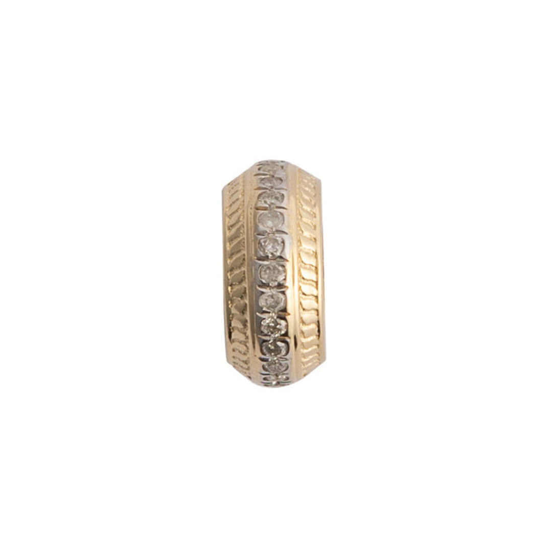 A single gold bead with roundel design, featuring a series of grooves and cut-out sections, possibly intended to be strung onto a necklace or bracelet.