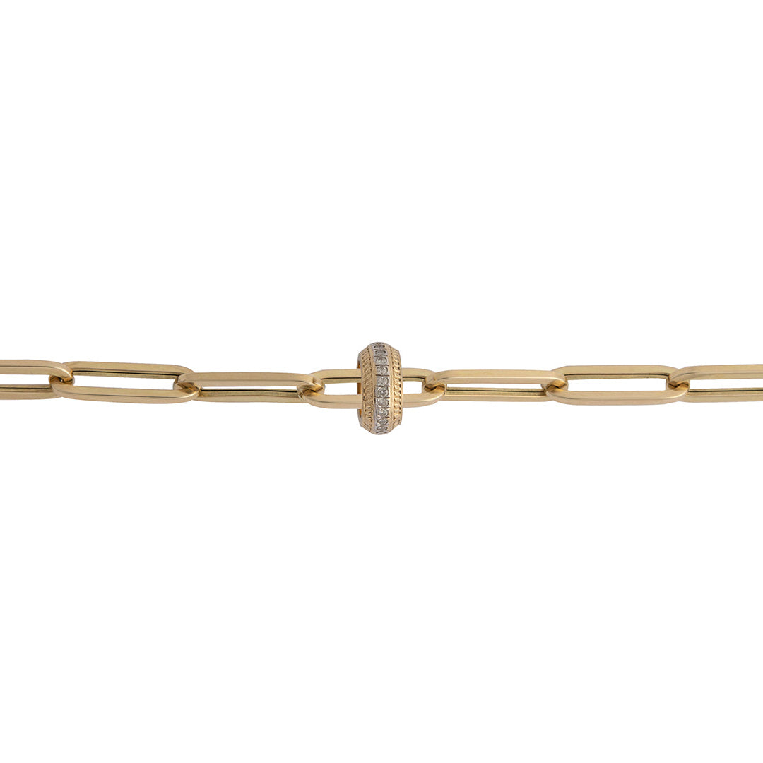A 14k gold paperclip chain with a gold and diamond roundel bead strung on it. 