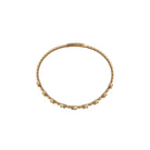 Gold bracelet on a white background