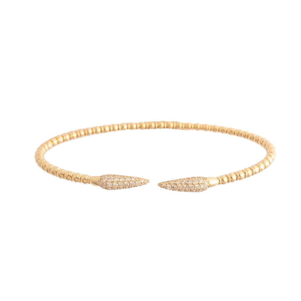 Gold bracelet with leaf-like ends on a white background