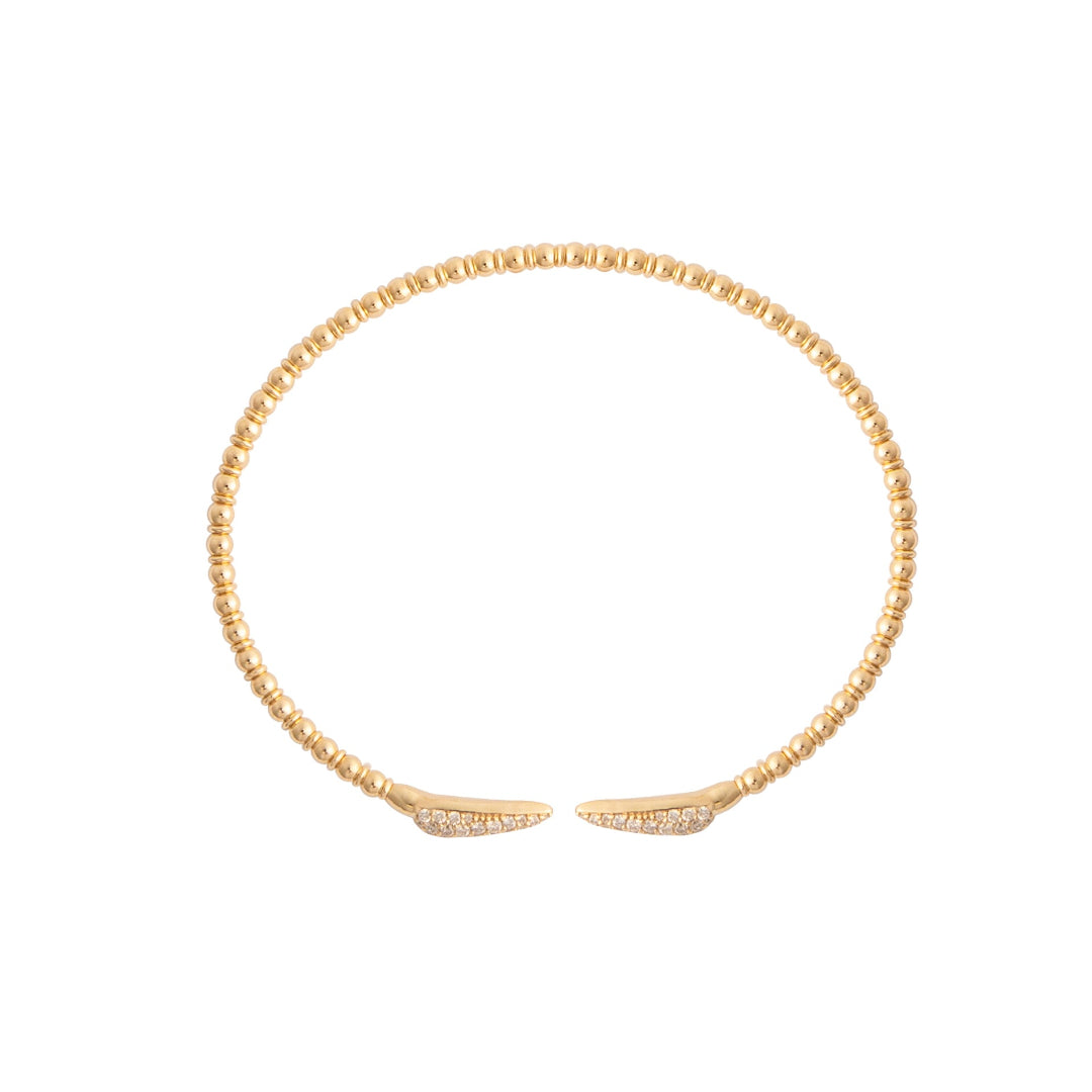 Gold flexi bangle on a white background