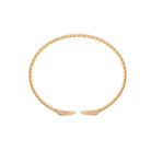 Gold flexi bangle on a white background