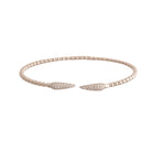 White gold bracelet with diamond pave claw design on a white background