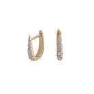 A pair of 14k gold Claw Diamond Huggie Earrings with a V-shaped design and diamond embellishments.