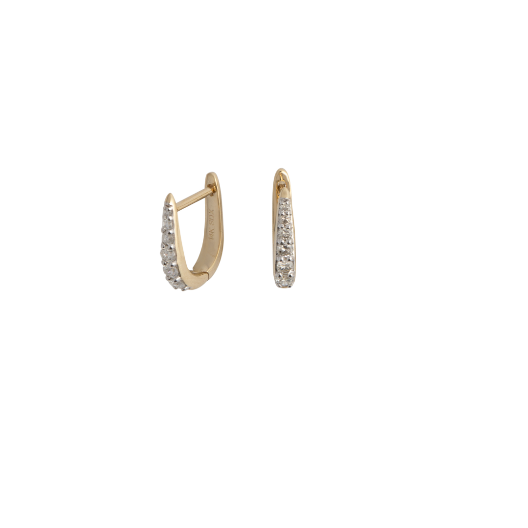 A pair of 14k gold Claw Diamond Huggie Earrings with a V-shaped design and diamond embellishments.