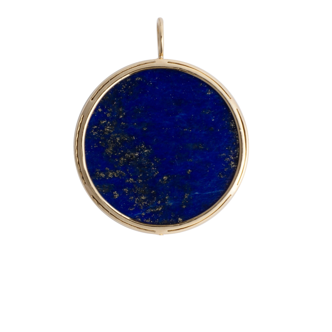 The back of a pendant, showcasing the lapis stone set in 14k gold. 