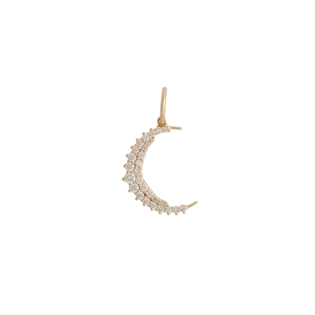 Gold crescent moon-shaped pendant with pavé diamond stones on a white background
