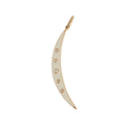 A gold crescent moon-shaped pendant with white enamel detailing and small diamonds around the edge.