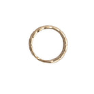A sideways view of a ring showcasing the 14k gold setting. 