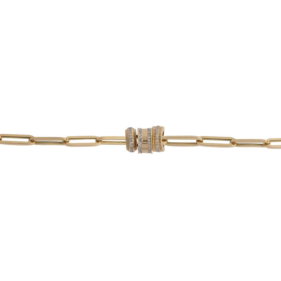 A 14k gold paperclip chain with three different 14k gold and diamond roundel beads on a white background.