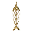 A 14k gold fish skeleton pendant accented with diamonds on a white background. 