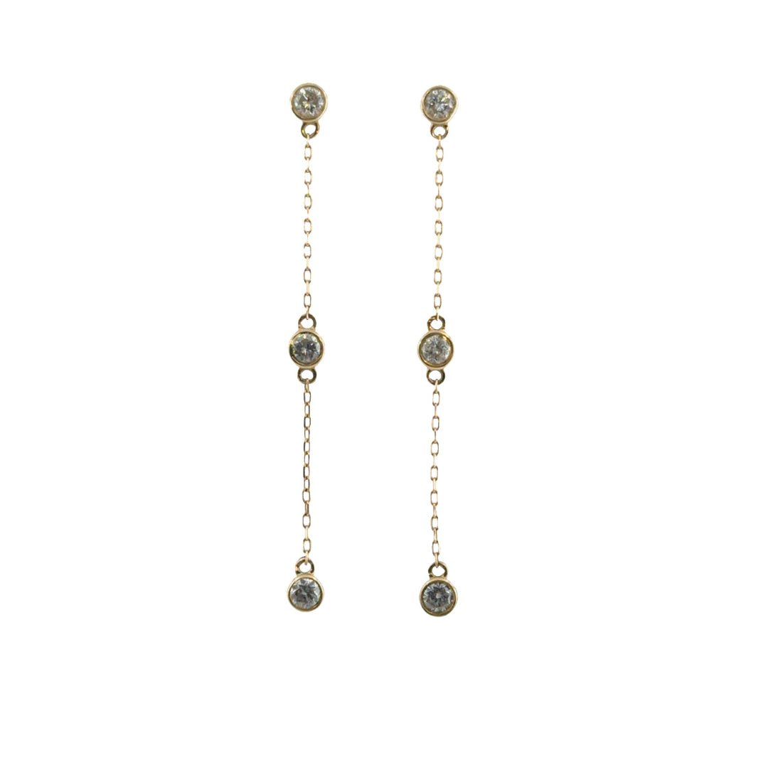 14k yellow gold diamond station drop earrings on a white background. 