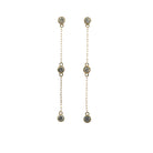 14k yellow gold diamond station drop earrings on a white background. 