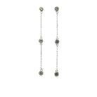 14k white gold diamond station drop earrings on a white background. 