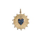 Gold pendant with a heart-shaped blue sapphires  on a white background