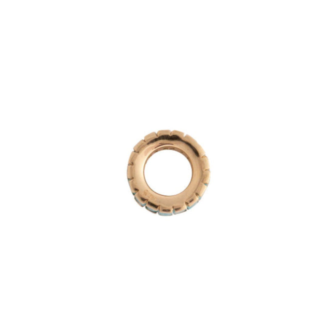 14k gold bead with emeralds on a white background
