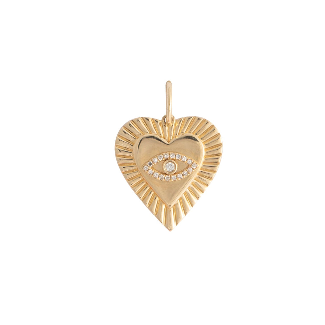 A gold heart pendant with an evil eye set on a 