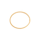 Gold bangle on a white background