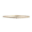 A diamond bracelet with graduated bezel set diamonds. 
