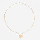 Gold diamond station necklace with a heart pendant on a white background.