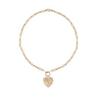 A 14k gold paperclip chain necklace with a beveled heart pendant attached with a pendant bail. 