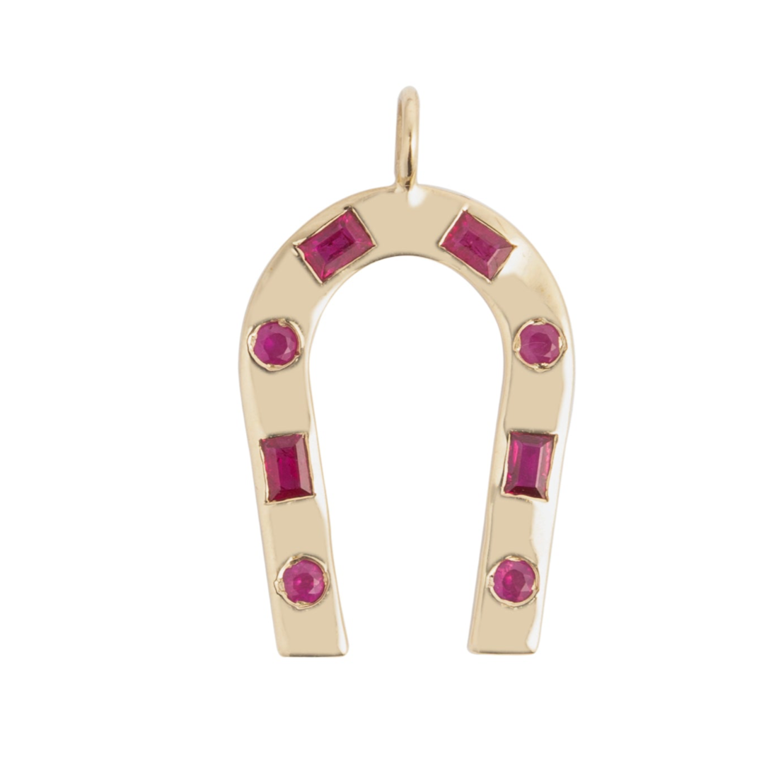 A 14k gold horseshoe-shaped pendant featuring .52 carats of red ruby stones.