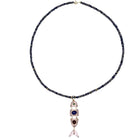 Iolite beaded necklace rose quartz fish pendant on a white background.
