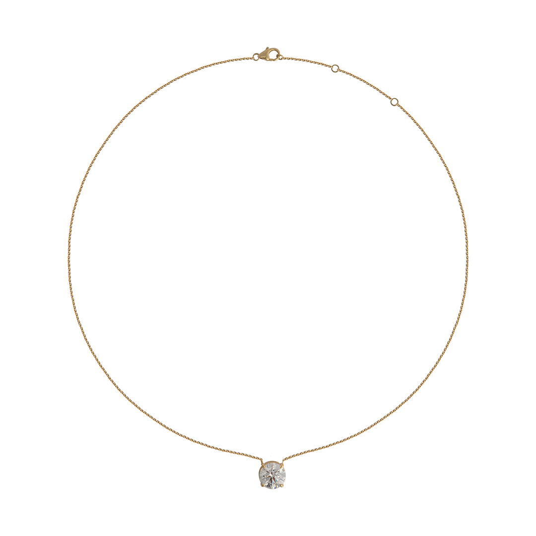 A lab-grown diamond solitaire necklace with a gold chain and a single diamond set in a mount at the bottom.