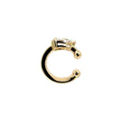 The sideways view of a 14k gold ear cuff with a .75 carat lab-grown diamond on a white background.