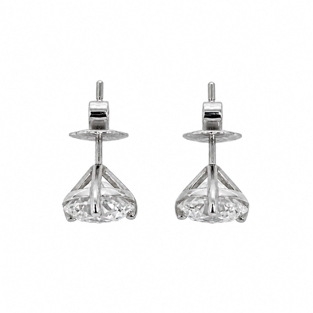 A pair of white gold stud earrings with diamonds, shown against a plain white background.