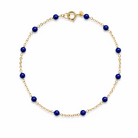 14k gold bracelet with lapis beads on a white background.