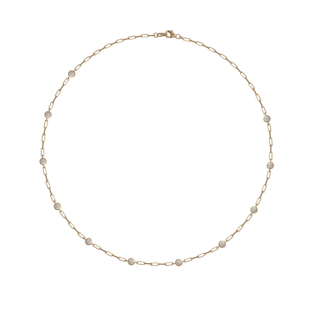 A gold-colored chain necklace featuring a series of round diamond stations attached to a central link.