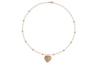 A whitebackground with a 14k gold diamond station paperclip chain necklace and a heart pendant with diamonds. 