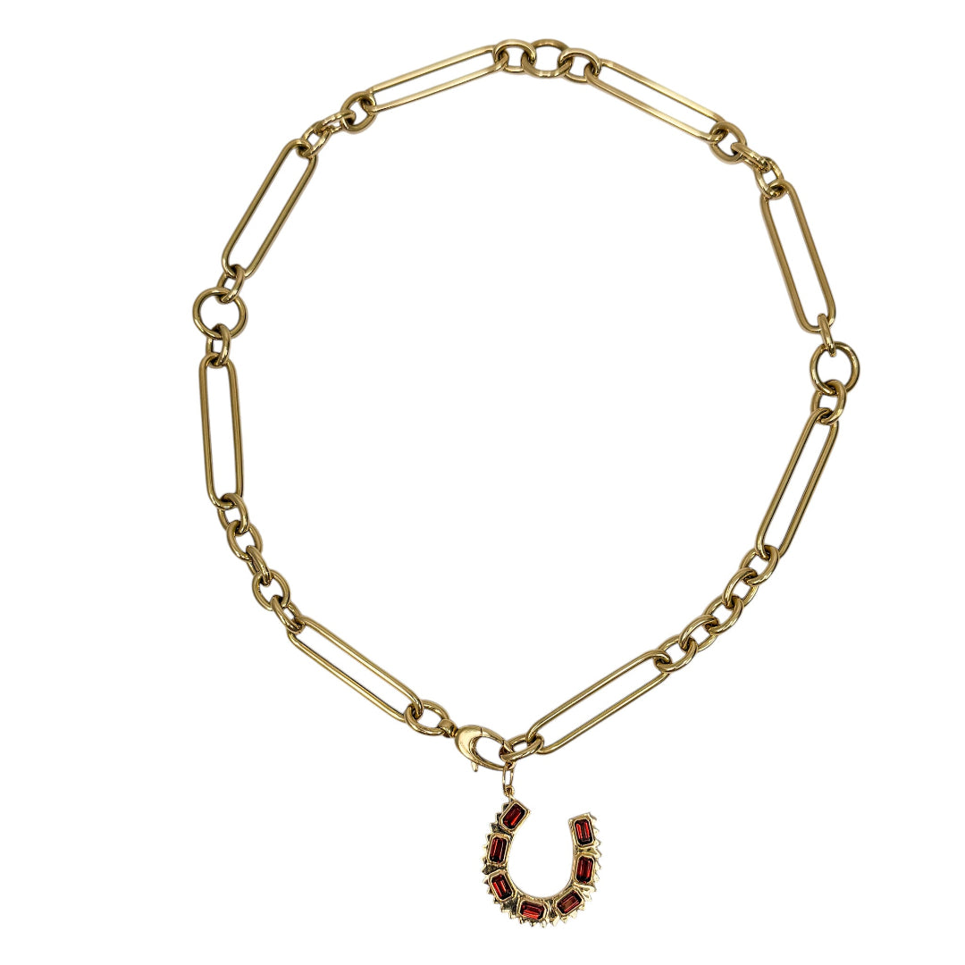 14k gold chain necklace with a horseshoe charm on a white background.
