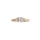 Gold ring with a diamond on a white background