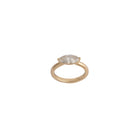 Gold ring with a diamond on a white background