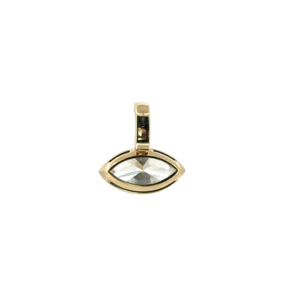 The back of a 14k gold  pendant showcasing a bezel set diamond.