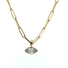A 14k gold bezel set diamond pendant on a paperclip chain. 