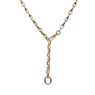 A 14k gold marquise shaped link chain styled as a lariat on a white background. 