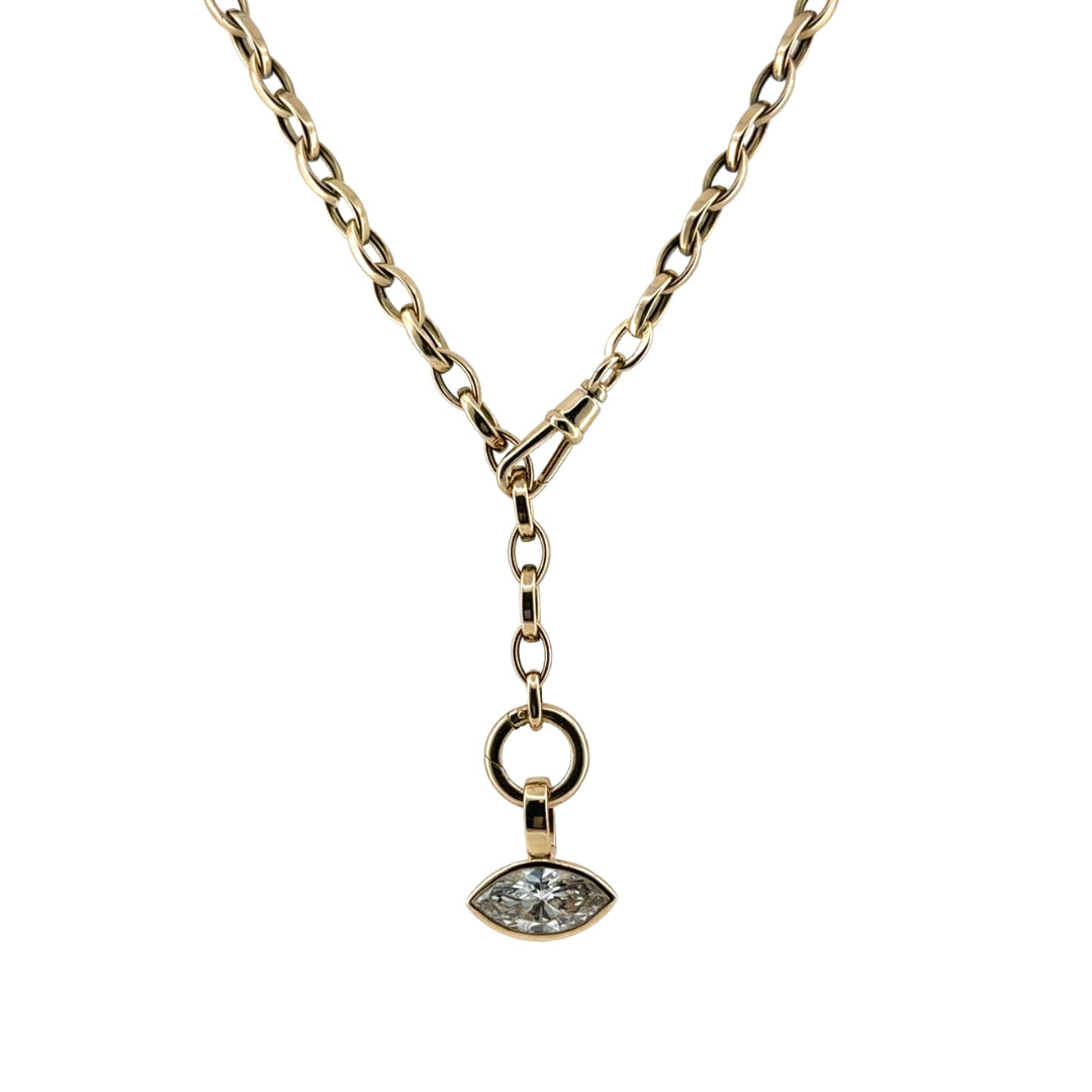 A 14k gold marquise shaped link chain styled as a lariat with a diamond pendant on a white background. 