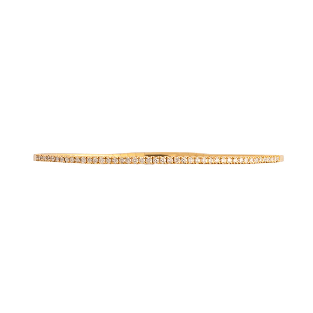 Gold bracelet with diamonds on a white background