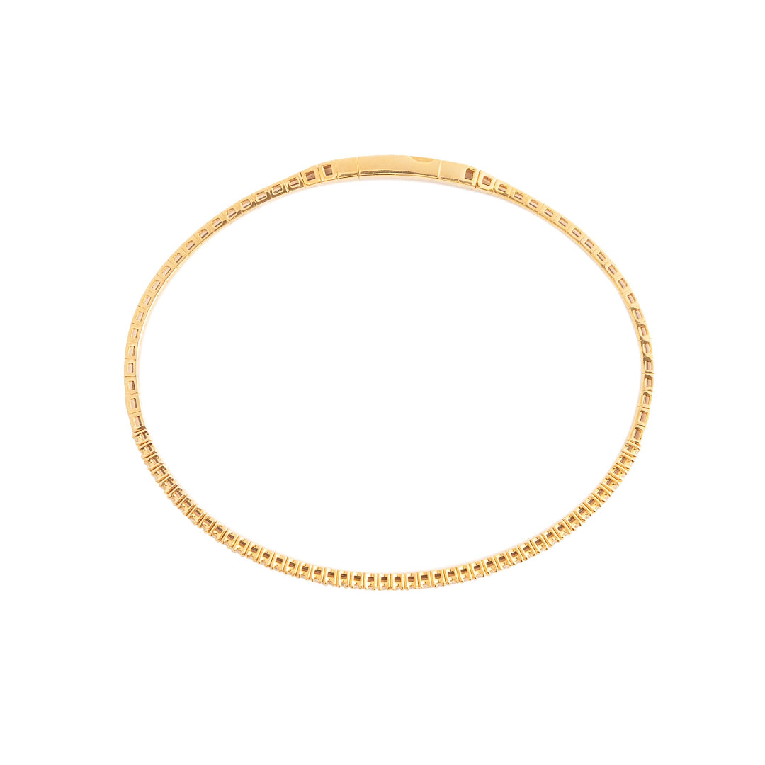 Gold bracelet on a white background