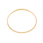 Gold bracelet on a white background