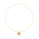 Gold necklace with a circular pendant on a white background