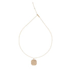 Gold ball chain necklace with a pave diamond pendant on a white background